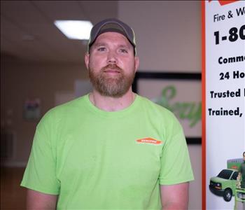 headshot of male technician in SERVPRO hat with a green SERVPRO shirt on.